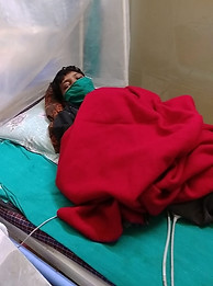 Patient resting in bed at Shanti Nilayam hospice