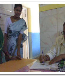 Success stories: a woman being helped at a hospital desk