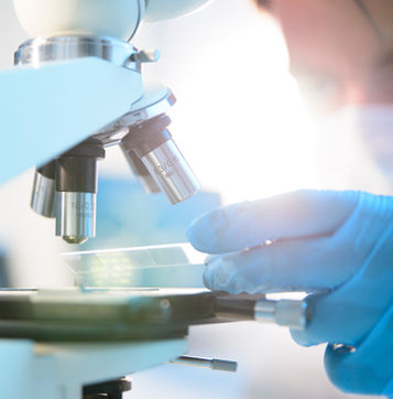 Scientist Using Microscope