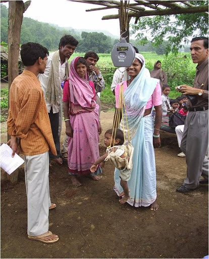 Weighing of Anganwadi Inmates by VHW