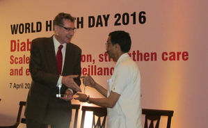 Dr. Ashish receiving WHO 'Public Health Champion' award from WHO India chief Mr. Henk Bekedam for ou