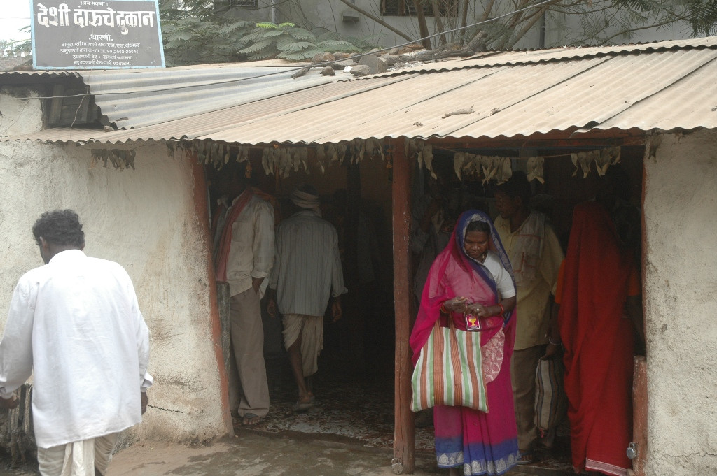 Tribal woman purchasing alcohol